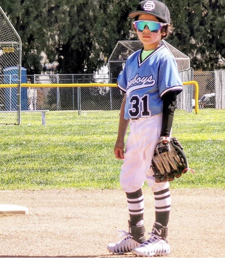 Young infielder wearing protective sleeve