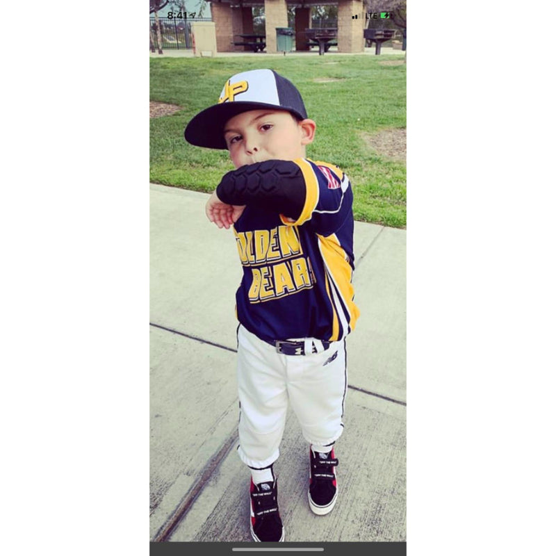 Close-up of youth baseball player in padded elbow sleeve