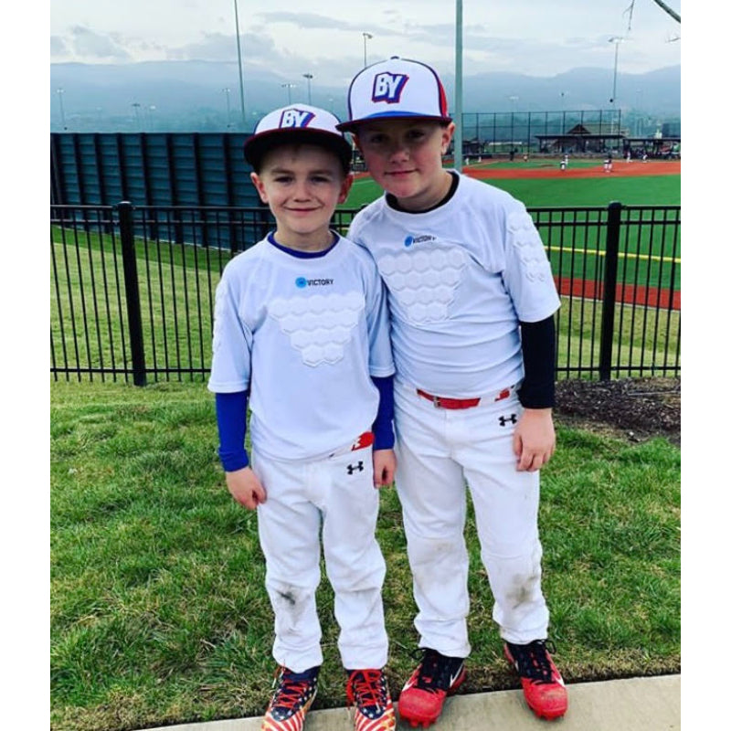 Close-up of youth baseball teammates in padded shirts